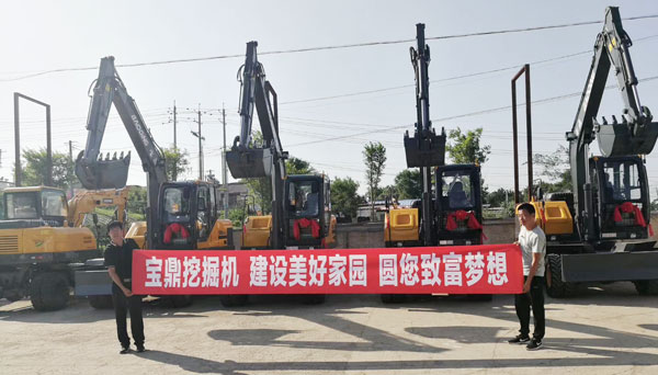 宝鼎轮式挖掘机抓木机致富贵州.jpg