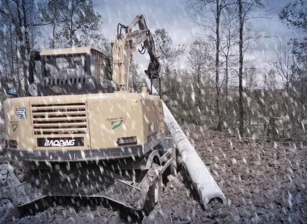 雪中做工的宝鼎轮式挖掘机.jpg